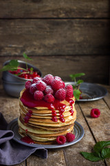 pancakes with fresh raspberry and powdered sugar