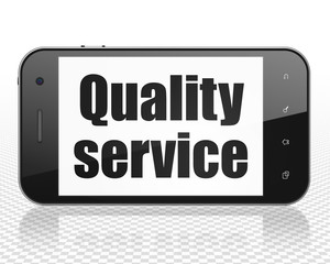 Business concept: Smartphone with Quality Service on display
