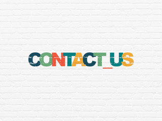 Business concept: Contact us on wall background