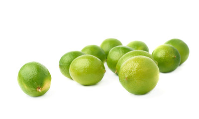 Surface covered with multiple ripe limes, composition isolated