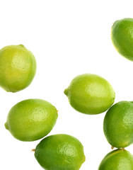 Surface covered with multiple ripe limes, composition isolated