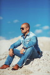 Obraz premium Man Relaxing On Beach