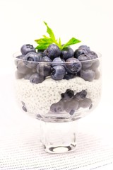 Fototapeta na wymiar Yogurt, chia seeds, blueberries and mint