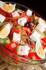Salad with tomato, eggs, cucumbers and cheese
