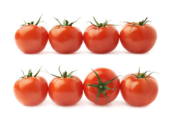 Four tomatoes in a line isolated