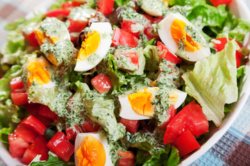 Summer salad with tomatos and boiled eggs
