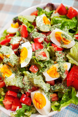 Summer salad with tomatos and boiled eggs