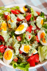 Summer salad with tomatos and boiled eggs