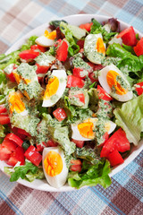 Summer salad with tomatos and boiled eggs