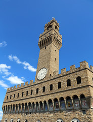 Florence Italy Historic clock tower building and blue sky