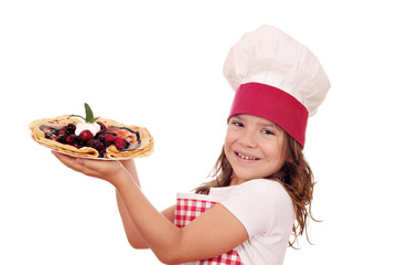 happy little girl cook with crepes