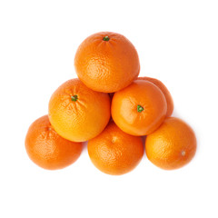 Pile of multiple ripe fresh juicy tangerines, isolated over the