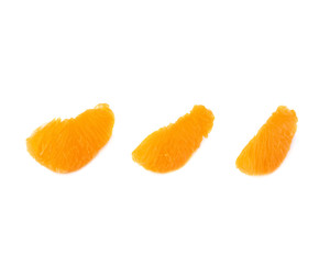 Slice sections of tangerine isolated over the white background