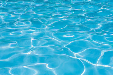 Pattern of blue water surface in swimming pool
