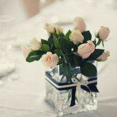 Wedding table with white roses.