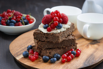 chocolate brownie cake with nuts and fresh berries 