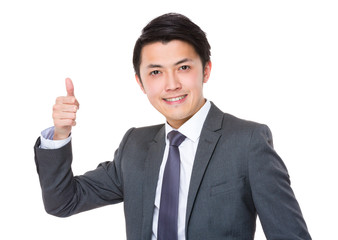 Fototapeta na wymiar Asian young businessman with thumb up gesture