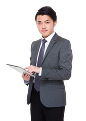 Asian young businessman use of the digital tablet pc
