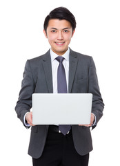 Asian businessman use of the notebook computer