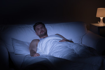 Fototapeta premium Man suffering from insomnia