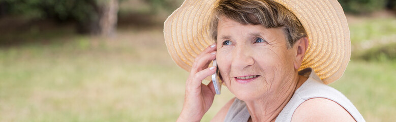 Senior woman in summer straw