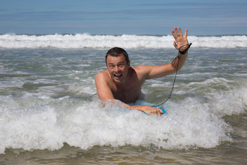 Man having fun at the beach during summertime