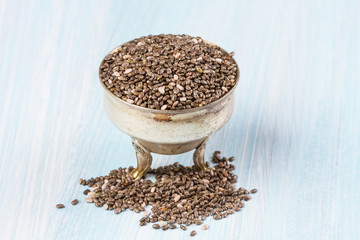 Chia seeds on wooden background. Horizontal image