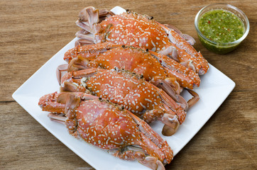 steamed crabs on wood background