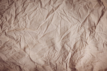 Creases, wrinkles, brown fabric texture for background.