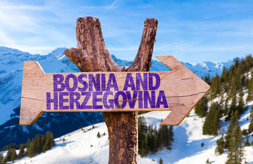 Bosnia and Herzegovina wooden sign with winter background