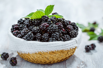 Basket of blackberries on table