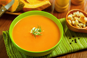 Pumpkin Soup with croutons on table