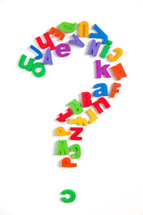 Question mark made of colorful magnetic fridge letters.