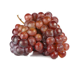 Bunch of red grapes , fresh with water drops. Isolated on white