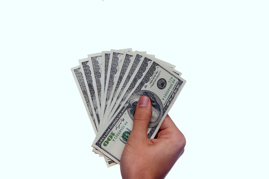 Hand holding money - United States dollar (USD)