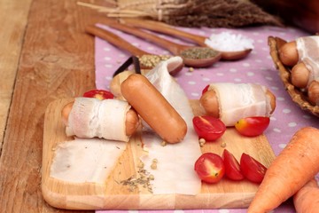  Sausages  wrapped in raw bacon fat at delicious.