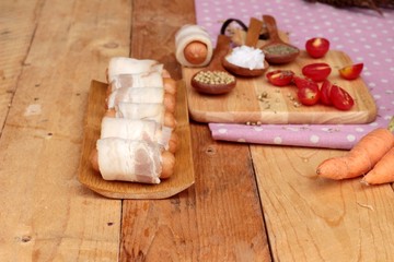  Sausages  wrapped in raw bacon fat at delicious.