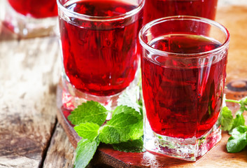 Pomegranate red cocktail with mint, selective focus