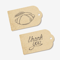 Craft paper tags with THANK YOU hand lettering and sketched - 90403221