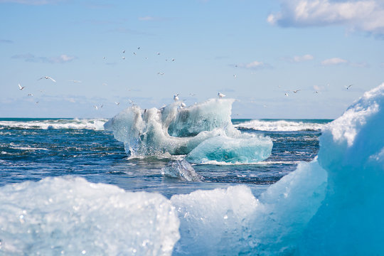 Melting glaciers climate change concept. Drifting icebergs in Atlantic ocean. Jokulsarlon lagoon, South Iceland, Vatnajokull glacier. Amazing travel destination.