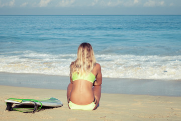 Fototapeta na wymiar Beautiful Surfer Girl on the Beach