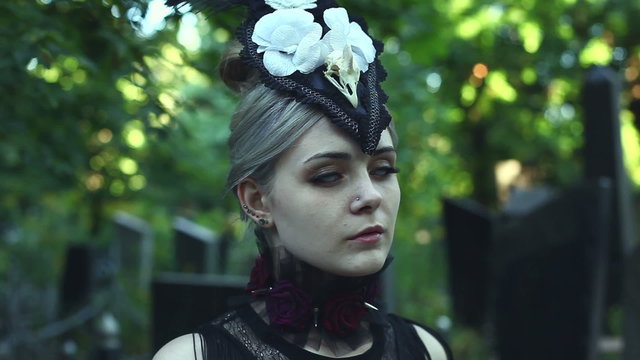 Mystical girl turns her head and cries. She in the Gothic style.