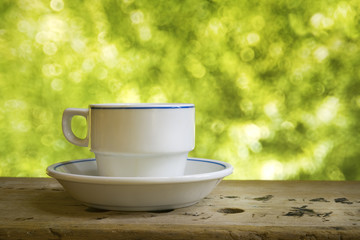 Cup of coffee against nature backgound