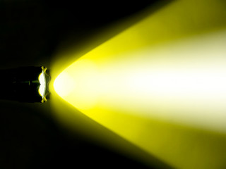 yellow light of the torch in the dark