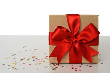  Gift box with red bow and red Christmas ball