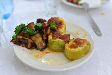 eggplant, zucchini stuffed with meat, rice, and mushrooms, grated cheese