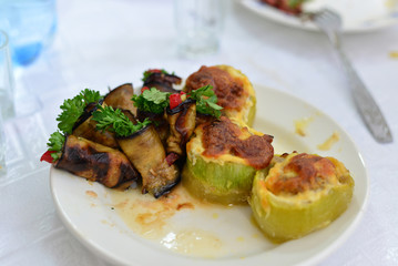 eggplant, zucchini stuffed with meat, rice, and mushrooms, grated cheese