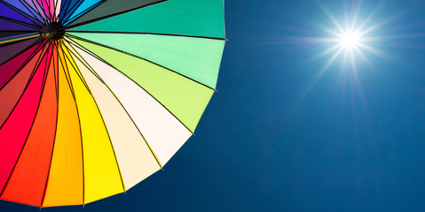 colorful umbrella segments on blue sky