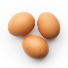 Three brown eggs