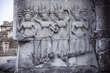 Apsara carvings status on the wall of Angkor temple, world herit